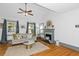 Living area featuring hardwood floors and a cozy fireplace at 1688 Richland Sw Rd, Atlanta, GA 30311