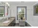 Bathroom with granite double vanity and large windows at 1688 Richland Sw Rd, Atlanta, GA 30311
