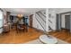 Bright dining area with hardwood floors, kitchen, and staircase at 1688 Richland Sw Rd, Atlanta, GA 30311