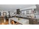 Spacious kitchen boasts granite island, dark cabinetry, and views into the living area at 1688 Richland Sw Rd, Atlanta, GA 30311