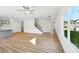 Open living area with hardwood floors and kitchen views at 11813 Rizvan Pl, Covington, GA 30014