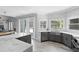 Modern kitchen with gray cabinets, white quartz countertops, and stainless steel appliances at 4385 Wieuca Ne Rd, Atlanta, GA 30342