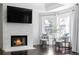 Modern white stone fireplace with a sleek, built-in TV at 4385 Wieuca Ne Rd, Atlanta, GA 30342