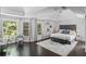 Bright main bedroom with large windows, hardwood floors, and a neutral color palette at 4385 Wieuca Ne Rd, Atlanta, GA 30342