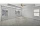 Large main bedroom with ceiling fan, carpeted floors and multiple windows at 11834 Rizvan Pl, Covington, GA 30014