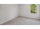 Bright bedroom with neutral walls and carpet flooring at 11834 Rizvan Pl, Covington, GA 30014