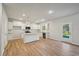 Modern kitchen with white cabinets, granite countertops, and island at 11834 Rizvan Pl, Covington, GA 30014