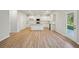 Open concept kitchen with island and stainless steel appliances at 11834 Rizvan Pl, Covington, GA 30014