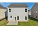 Two-story house with gray siding, backyard, and patio at 11834 Rizvan Pl, Covington, GA 30014