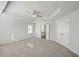 Spacious main bedroom with high ceilings, ceiling fan, and en-suite bathroom access at 11834 Rizvan Pl, Covington, GA 30014