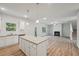 Open kitchen with large island and living room views at 11834 Rizvan Pl, Covington, GA 30014