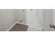 Small laundry room with vinyl flooring and space for washer and dryer at 11834 Rizvan Pl, Covington, GA 30014