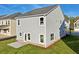 Two-story house with gray siding, backyard, and patio at 11834 Rizvan Pl, Covington, GA 30014