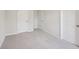 Empty bedroom with neutral walls and carpeting, ready for your furniture at 11834 Rizvan Pl, Covington, GA 30014