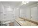 Bright bathroom featuring a tub shower, granite vanity, and white fixtures at 11834 Rizvan Pl, Covington, GA 30014