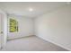 Bright bedroom featuring neutral walls and carpet at 11824 Rizvan Pl, Covington, GA 30014