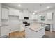 Kitchen features white cabinets, granite countertops and stainless steel appliances at 11814 Rizvan Pl, Covington, GA 30014