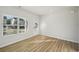 Bright and airy flex room with wood-look floors and windows at 11814 Rizvan Pl, Covington, GA 30014