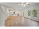 Open concept living room and kitchen with LVP flooring and backyard access at 11814 Rizvan Pl, Covington, GA 30014