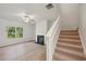 Living room with hardwood floors, fireplace, and ceiling fan at 11814 Rizvan Pl, Covington, GA 30014