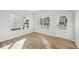 Spacious flex room with wood-look floors, multiple windows and exterior door at 11814 Rizvan Pl, Covington, GA 30014