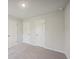 Simple bedroom with carpet and neutral wall colors at 11814 Rizvan Pl, Covington, GA 30014