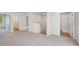 Spacious loft area with carpeted floor and access to bedrooms and bathroom at 11814 Rizvan Pl, Covington, GA 30014