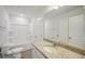 Main bathroom with shower/tub combo, granite countertop and white cabinets at 11814 Rizvan Pl, Covington, GA 30014