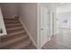 Carpeted staircase leading to the upper level at 11814 Rizvan Pl, Covington, GA 30014