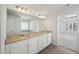 Double vanity bathroom with granite countertop and view of bedroom at 11814 Rizvan Pl, Covington, GA 30014