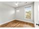 Light and airy bedroom with hardwood floors and a window at 370 Thrasher St # 2, Norcross, GA 30071