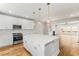 Modern kitchen with white cabinets, stainless steel appliances, and hardwood floors at 370 Thrasher St # 2, Norcross, GA 30071
