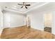 Bright bedroom featuring hardwood floors and multiple doors at 370 Thrasher St # 2, Norcross, GA 30071