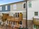 Rear view of townhouses with private decks and fenced yards at 370 Thrasher St # 2, Norcross, GA 30071