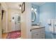 Powder room with granite vanity and light blue walls at 1911 Geyser Trce, Lawrenceville, GA 30044