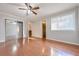 Bright bedroom with hardwood floors and mirrored closet doors at 4650 Heather Ct, Union City, GA 30291