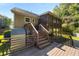 Elevated deck with stairs leading to backyard patio at 1924 Avis Ln, Tucker, GA 30084