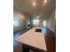 Modern kitchen island with white quartz countertops and dark cabinetry at 265 Lakeside Place, Canton, GA 30114