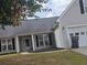 Two story house with gray siding, black shutters and a two car garage at 257 Se Ashland Park Se Ct, Lawrenceville, GA 30045