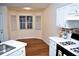 Kitchen with bay window and white cabinets at 257 Se Ashland Park Se Ct, Lawrenceville, GA 30045