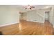 Hardwood floor living room with fireplace and staircase at 530 S Lost Lake S Cv, Villa Rica, GA 30180