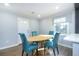 Dining area featuring an oval table and teal chairs at 2702 Wedgewood Ter, Decatur, GA 30032