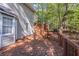 Back deck with wooden railings and lattice fence at 1507 Hillside Se Dr, Conyers, GA 30094