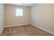 Spacious bedroom with neutral walls and carpet flooring at 1507 Hillside Se Dr, Conyers, GA 30094