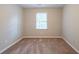 Bright bedroom with neutral walls and carpet flooring at 1507 Hillside Se Dr, Conyers, GA 30094