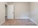 Simple bedroom with neutral walls and carpet flooring at 1507 Hillside Se Dr, Conyers, GA 30094