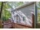 Deck with wooden railings and view of trees at 1507 Hillside Se Dr, Conyers, GA 30094