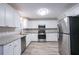 Kitchen with white shaker cabinets and granite countertops at 1507 Hillside Se Dr, Conyers, GA 30094