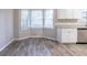 Bright kitchen, featuring a bay window and granite countertops at 1507 Hillside Se Dr, Conyers, GA 30094