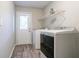 Laundry room with washer, dryer, and exterior access at 1507 Hillside Se Dr, Conyers, GA 30094
